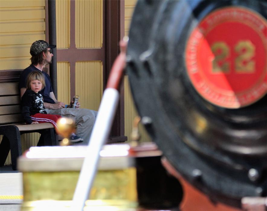 Photos by Brett Fisher. A child waits at Wabuska Station with Inyo Engine No. 22 in the foreground.