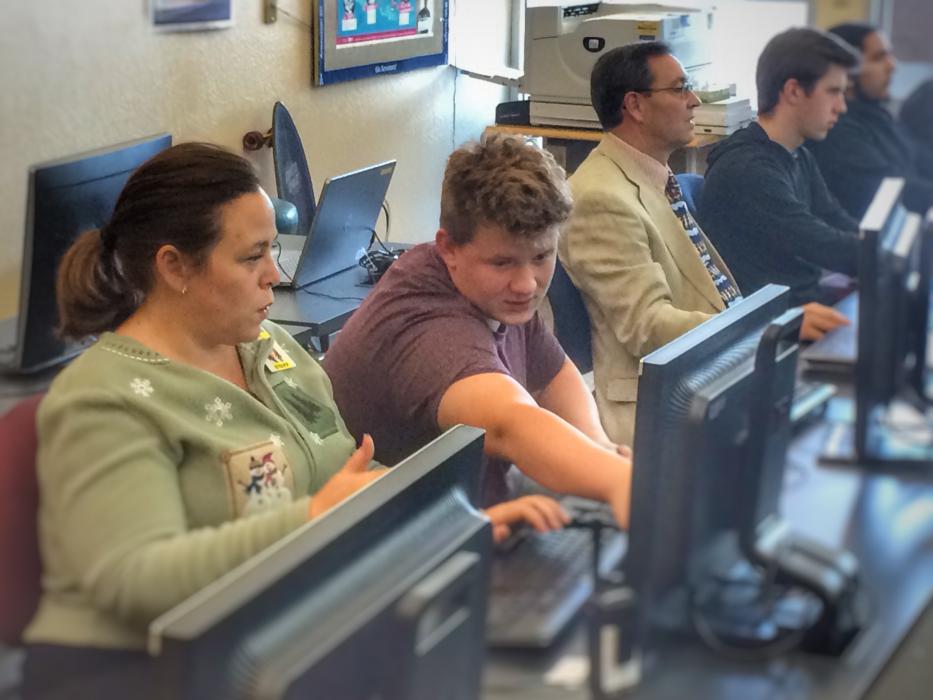 CHS Principal Tasha Fuson, Ryan Maxwell, CCSD Supt. Richard Stokes and student Aidan Ward during 2017's Computer Science Week.