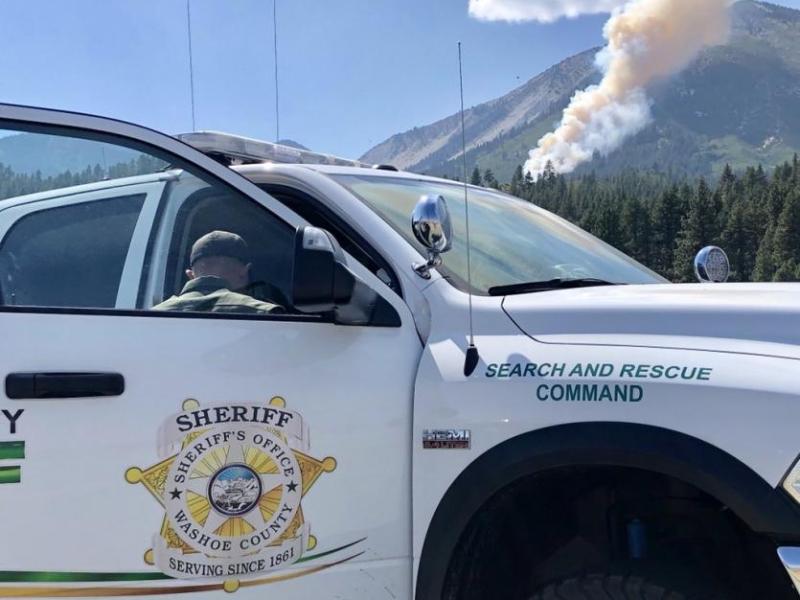Firefighters work to contain the Slide Fire that started Sunday. 1 died in the aircraft crash that resulted in the fire.
