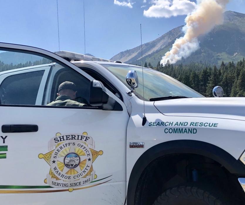 Firefighters work to contain the Slide Fire that started Sunday. 1 died in the aircraft crash that resulted in the fire.