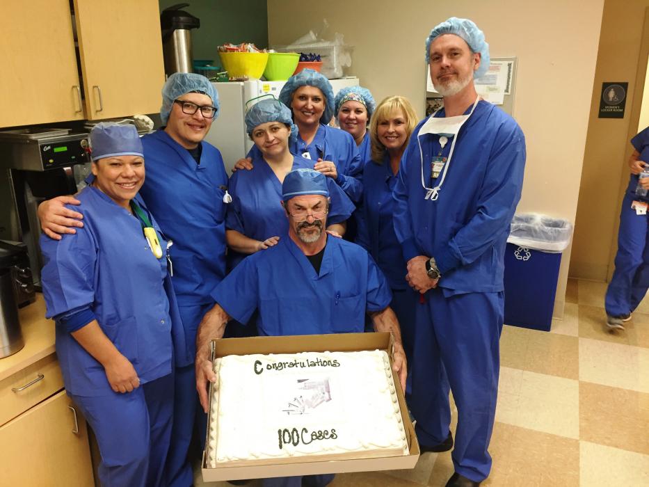Carson Tahoe Health surgeons celebrate 100 robotic-assisted surgeries with cake.
