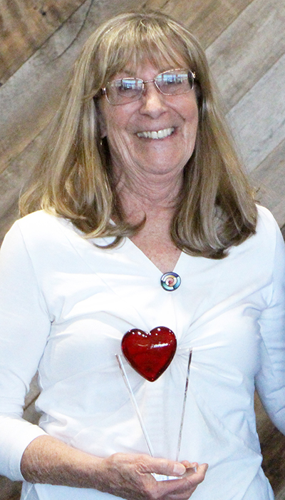 Chris Longley with the Claire Bauer Heart of a Volunteer Award