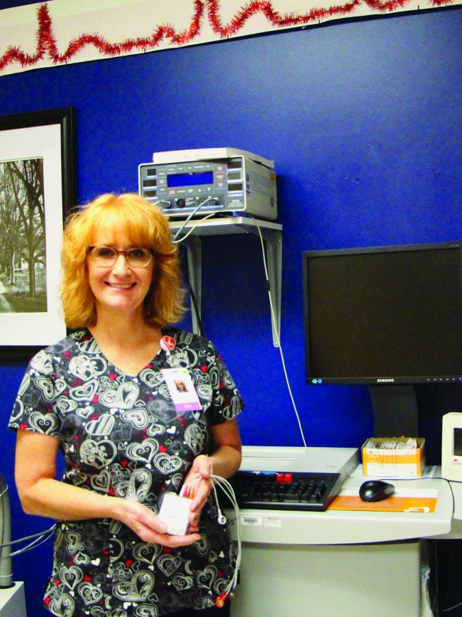 Carson Valley Medical Center EKG Technician Lorri Cervantes holds a Holter monitor.