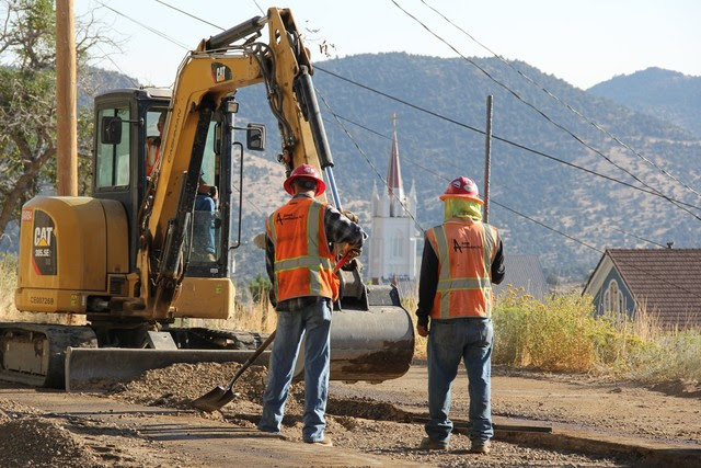 Workers from Ames Construction finish up the last of 13 miles of wastewater connection lines in Virginia City.