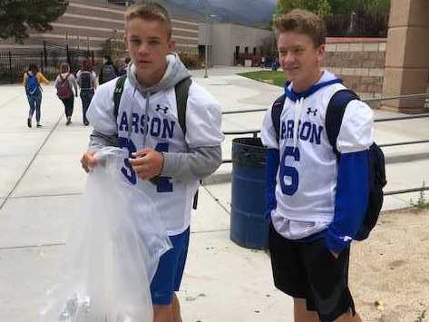 CHS Football players helping pick up scraps during the Week of Respect.
