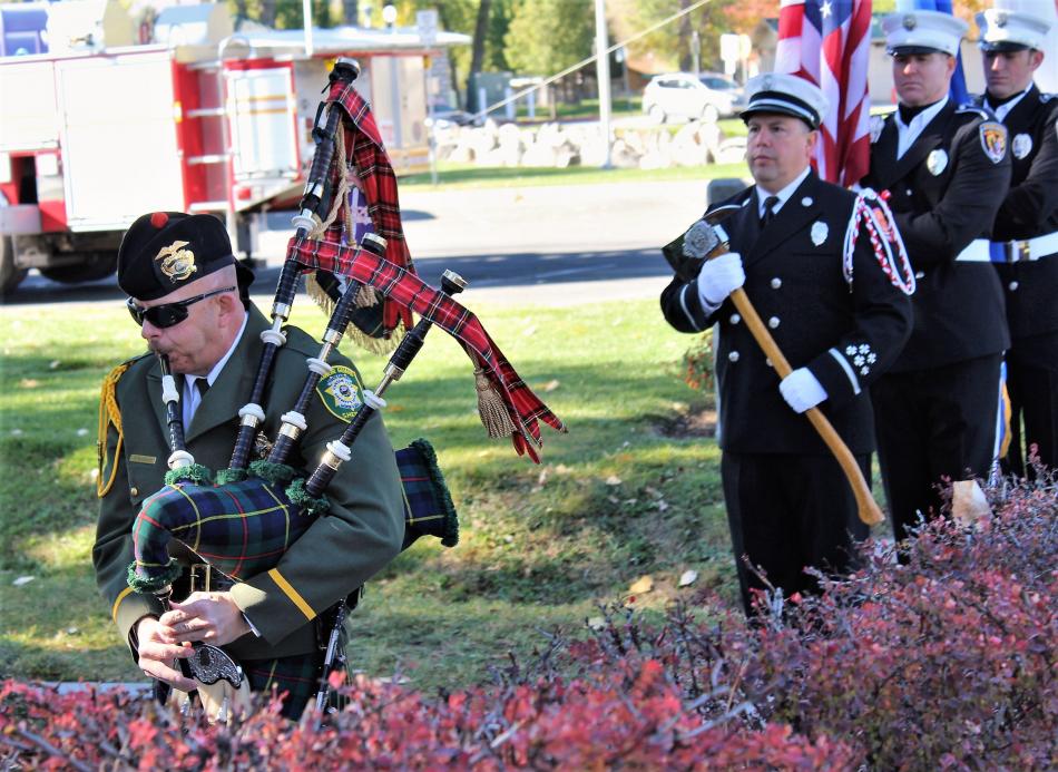 A bagpiper leads the Honor Guard procession into the Nevada Firefighters Memorial Saturday.