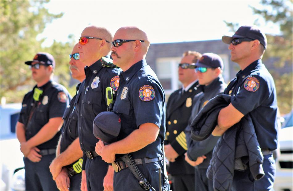 Photos by Brett Fisher. Carson City Firefighter-Paramedics listen to the chaplain's invocation Saturday.
