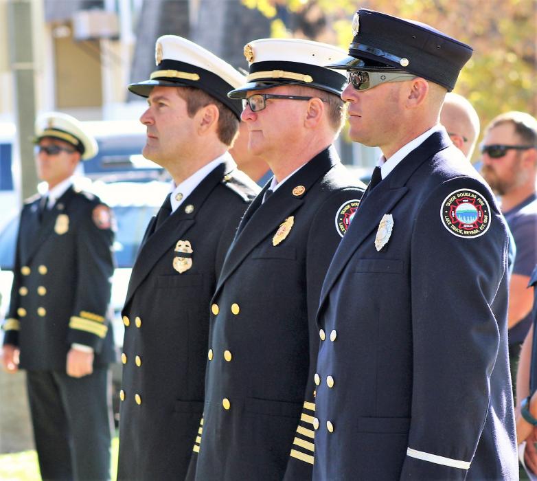 Carson City Fire Chief Sean Slamon (second left) stands with other firefighters at Saturday's memorial.