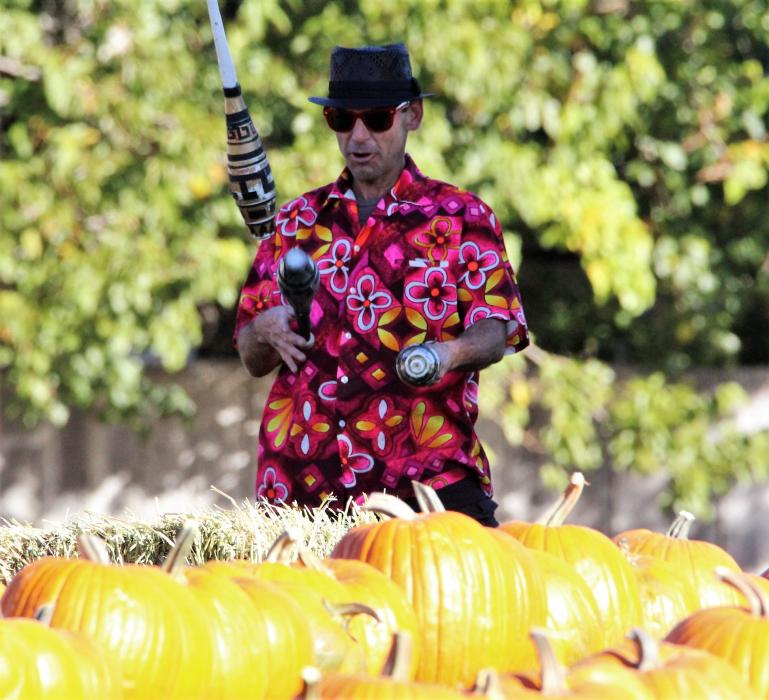 A juggler entertains guests at the Seeliger Elementary Pumpkin Patch Saturday morning.