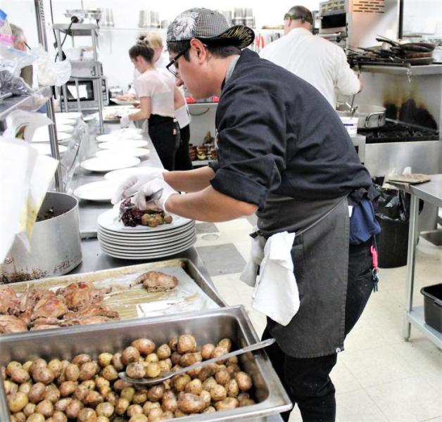Photos by Brett Fisher. Adrian Morales, Kierra Bell, John Schultz and Chef Roberta Davies work in the Bleu Cafe kitchen.