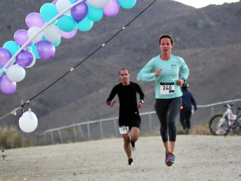 Photos by Brett Fisher. Runners complete the first lap of the 10K course Saturday night.