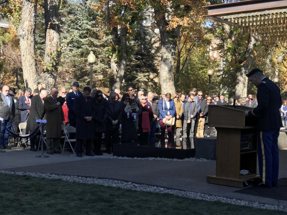 Gov. and First Lady Sandoval bow their heads in prayer given by Chaplain Hal Woomer, Nevada Air National Guard