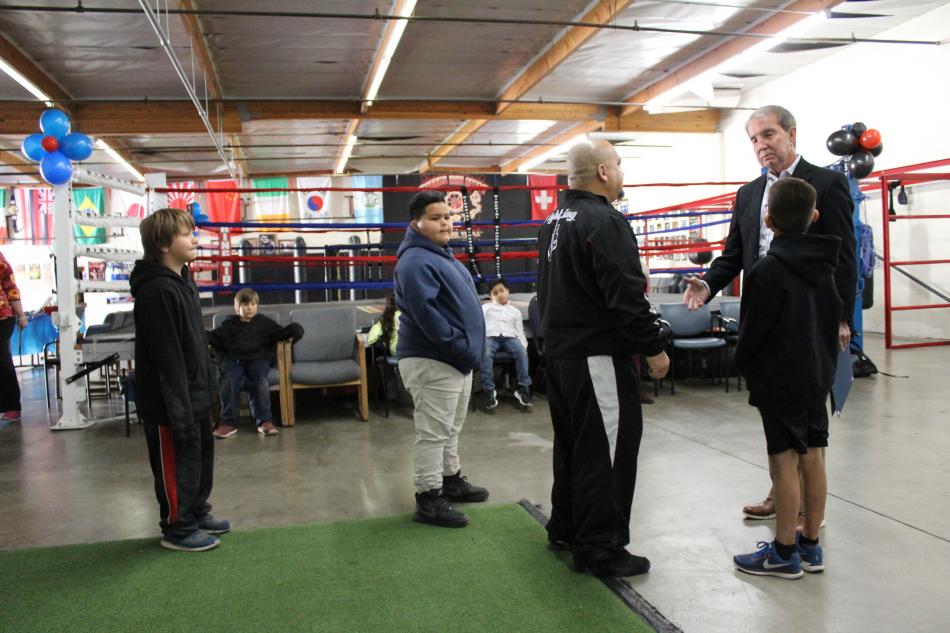 Carson City Mayor Bob Crowell chats with Cisco Rodriguez inside the competitive training gym.