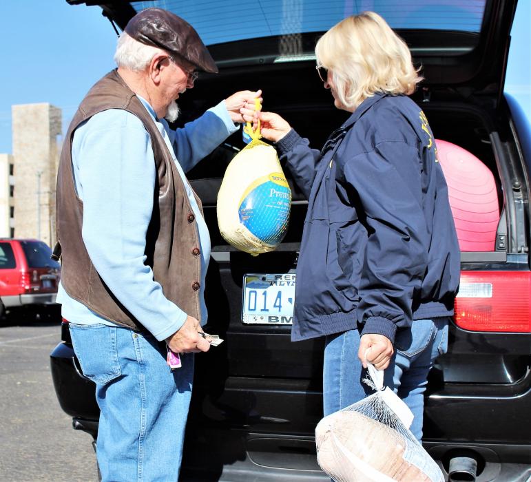 A donor delivers some frozen turkeys to Friday's Turkey Drop at the Max Casino.