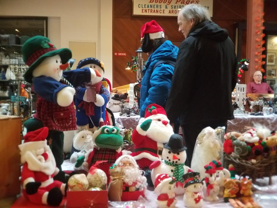 Photo by Brett Fisher. Shoppers inside the Carson Mall Saturday.