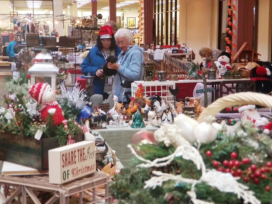 Photo by Brett Fisher. Shoppers inside the Carson Mall Saturday.