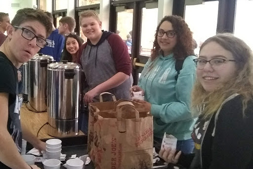 CHS FCA giving hot chocolate to students.