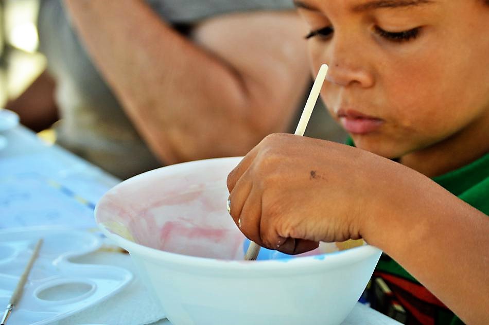 Photo by Brett Fisher. Skylar Easley of Reno paints an empty bowl during the summer of 2016.