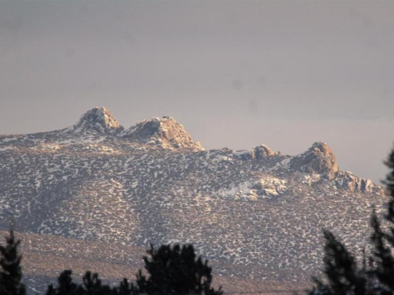 Photos by Brett Fisher. A glint of sunshine reflects off rocks south of Prison Hill.