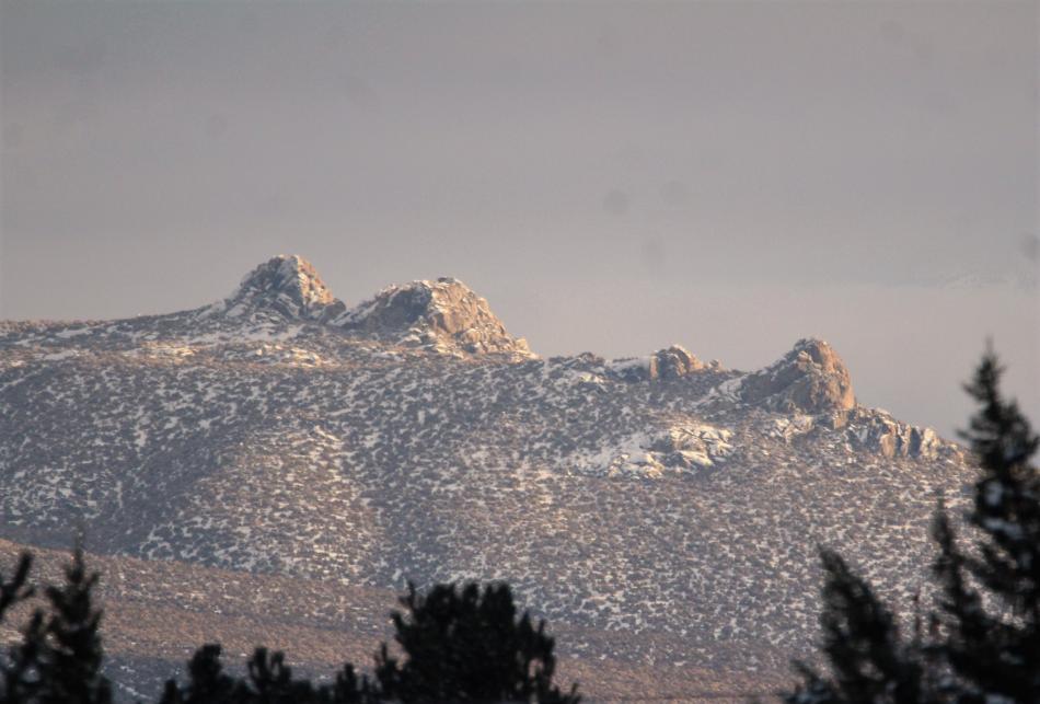 Photos by Brett Fisher. A glint of sunshine reflects off rocks south of Prison Hill.