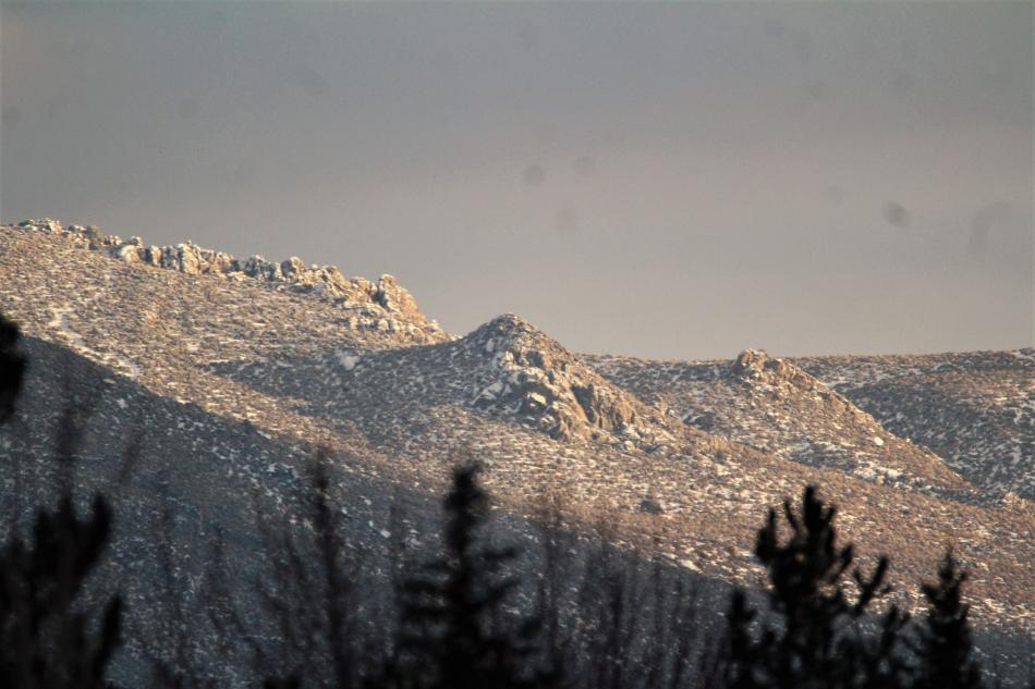 Rocks on the southern end of Prison Hill reflect sunlight late Friday afternoon.