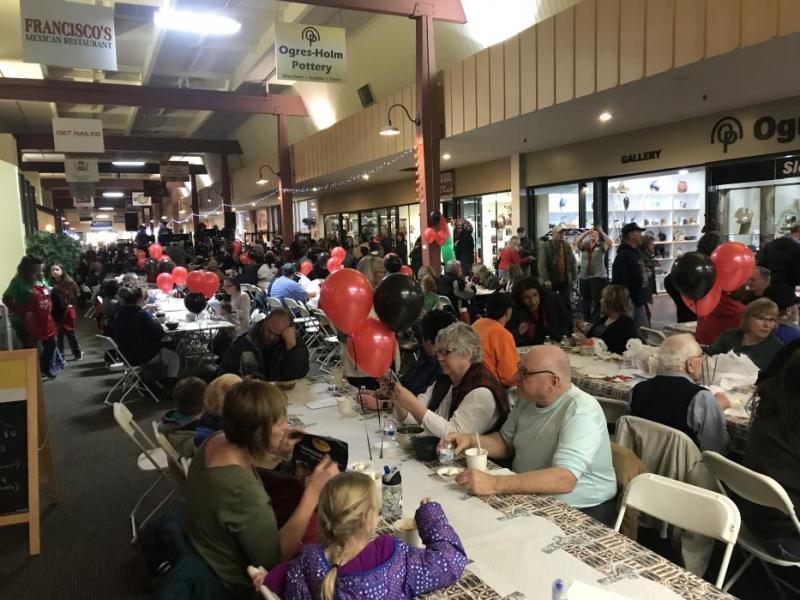 A crowd of hungry guests enjoy eating soups from 24 local restaurants.