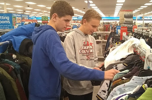 CHS FCA members Bamma Ingram and Zack Sever purchasing Angel Tree Christmas gifts for  those in need.