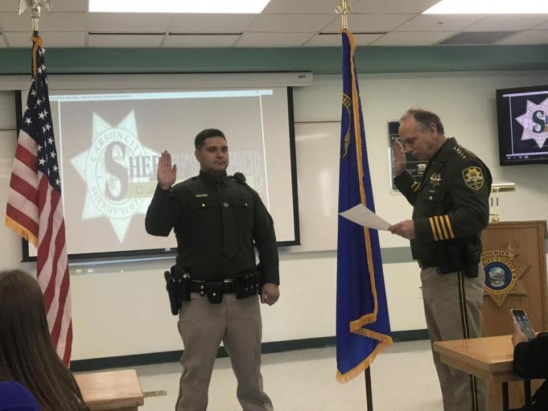 Cristian Diarte takes his oath with Sheriff Kenny Furlong.