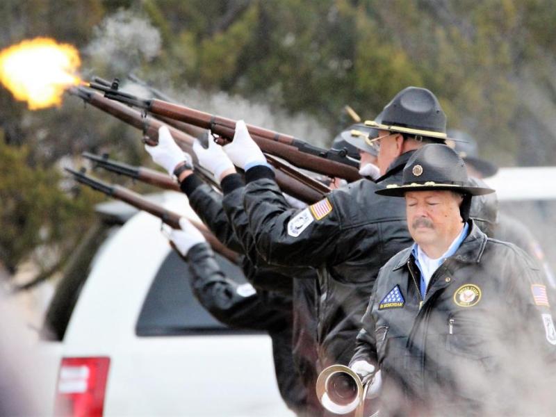 Photos by Brett Fisher. Honor guard members fire off a 21-gun salute during the "Wreaths Across America" ceremony Saturday.