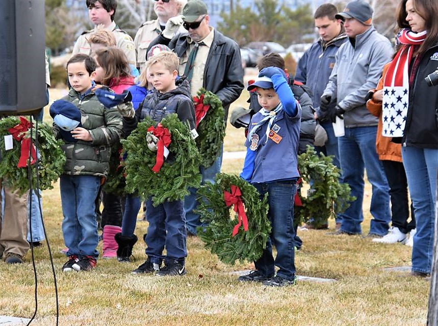 Photos by Phyllis Johnson Nosek. Children wait to lay wreaths Saturday at Eastside Memorial Park.