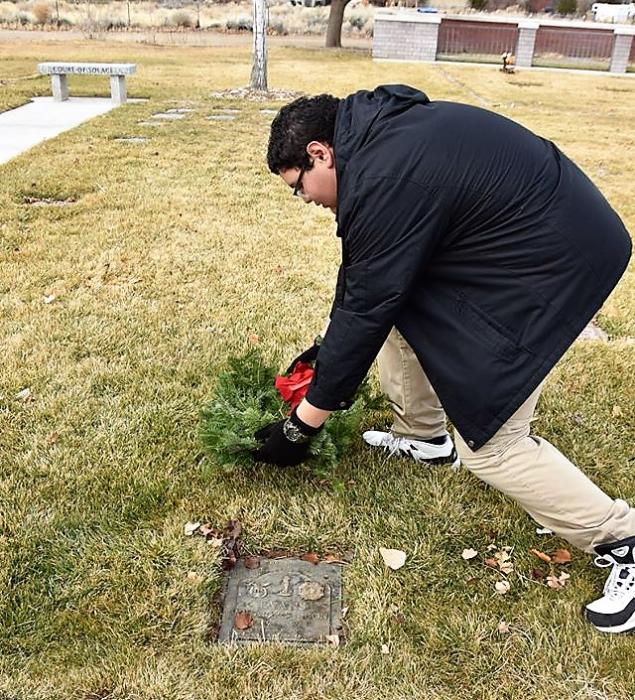 A wreath is laid graveside Saturday at Eastside Memorial Park.