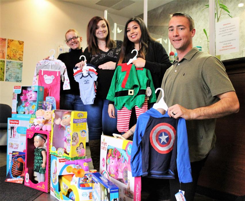 Photos by Brett Fisher. DCFS staff in Carson City with clothing and toys donated for the Angel Tree.