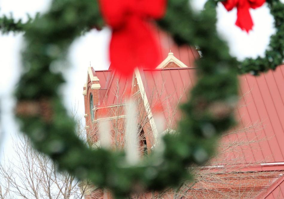 The Laxalt Building at Carson and Telegraph streets framed within a Christmas wreath.