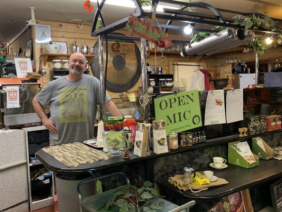 Photos by Kelsey Penrose. Owner Mike Epps stands in front of the tea counter at A to Zen