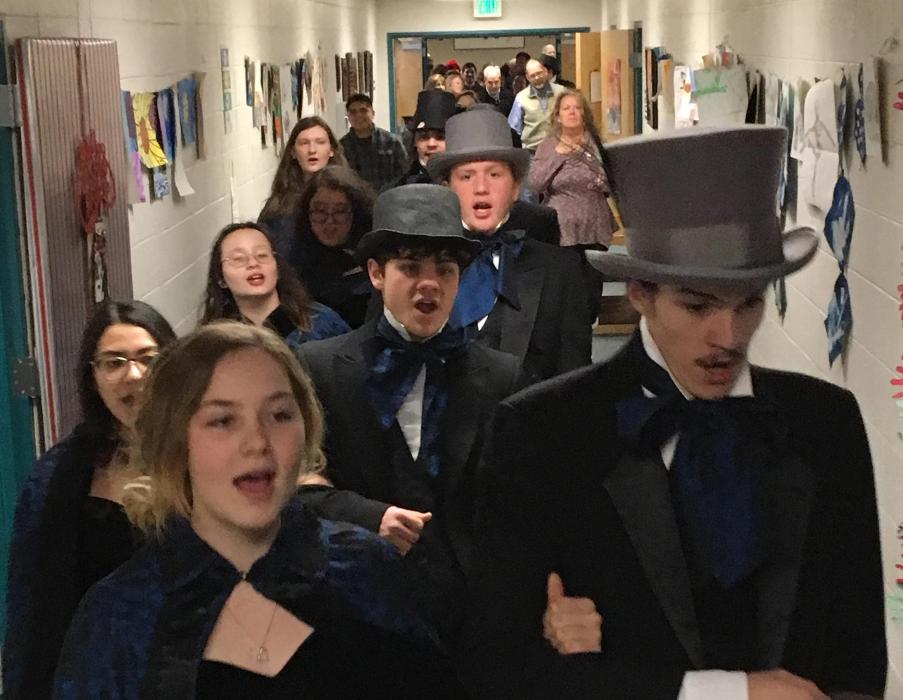 CHS Chamber Choir caroling at CCSD schools.