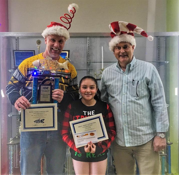 Eagle Valley Middle School Principal Lee Conley (left) with seventh-grader Vielka Lopez Munguia and Jim Peckham of FISH.