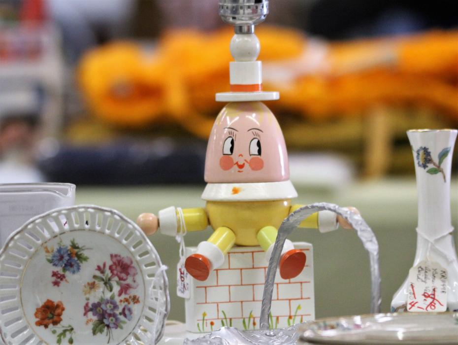 An antique Humpty Dumpty lamp stand.