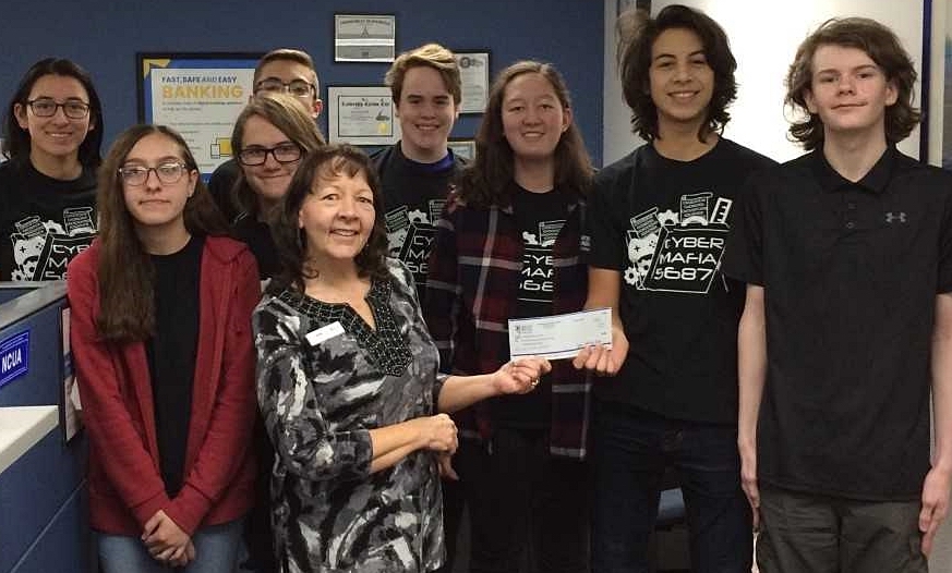 Greater Nevada Credit Union presenting a sponsorship check to the Carson High School Robotics team, Cyber Mafia.