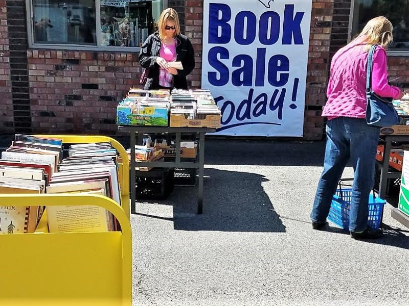 Photo by Brett Fisher. Parking lot book sale at Browser's Corner.