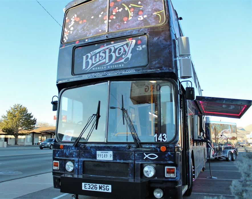 The English double-decker bus features both street-side and sit-down service.