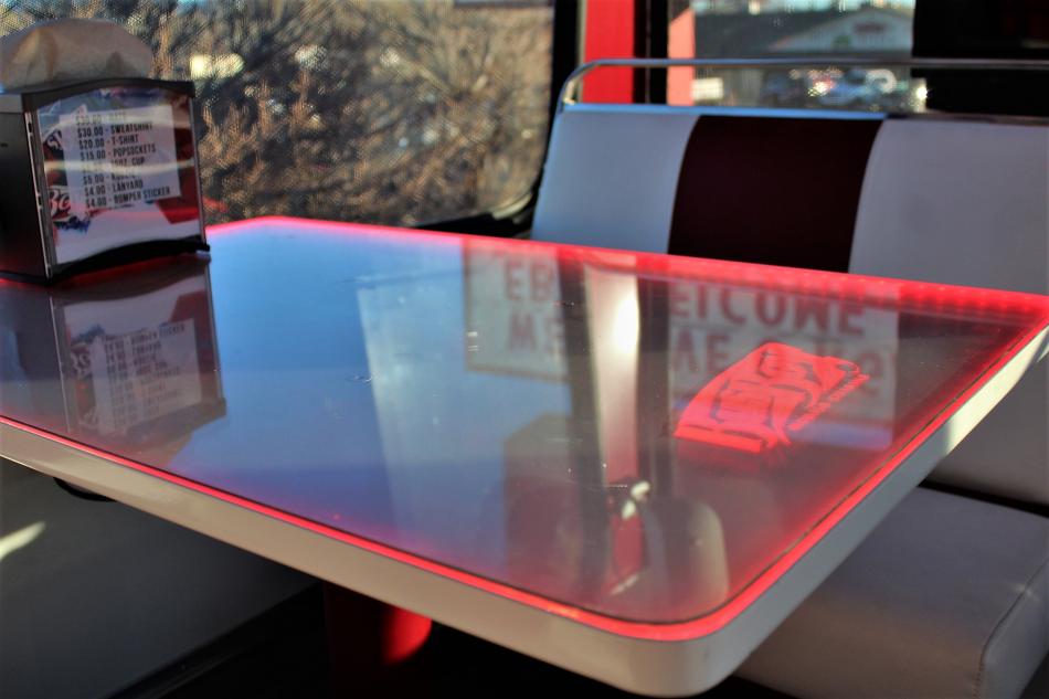 A table lit up with fun neon lighting.