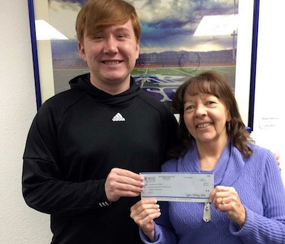 CHS student Jacob Nichols, FBLA Co-President and Past State Champion with GNCU Education Branch Coordinator Julie Slocum.