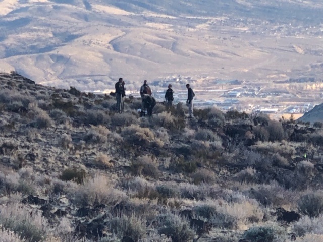 Investigators search the area where human remains were discovered. Photo by CCSO