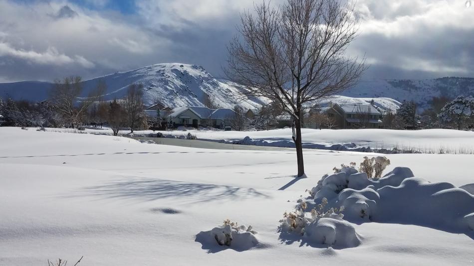 Photo by Brett Fisher. Sunshine breaks through the snowstorm Tuesday afternoon, giving C Hill a shimmering glow.