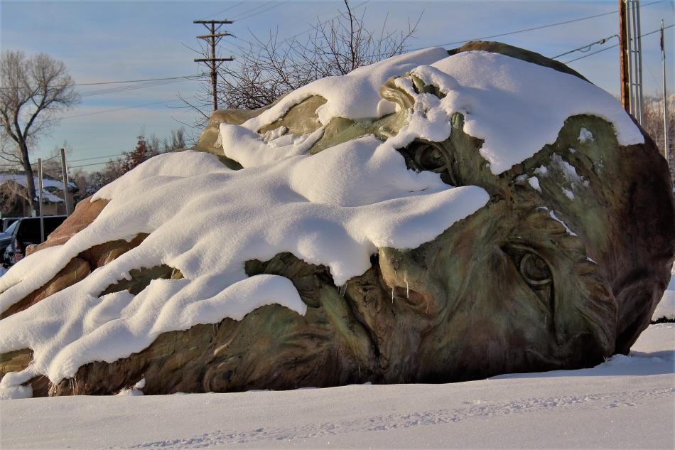 Photo by Brett Fisher. Morning sun shines on a snow-covered Mind of DaVinci sculpture at the Carson City Community Center.