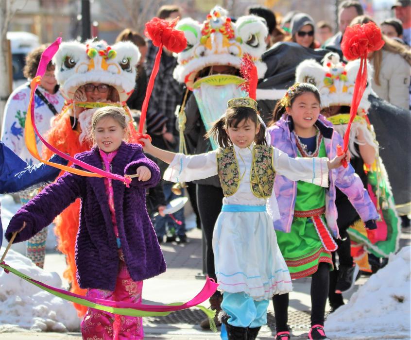 Photos by Brett Fisher. Children lead the Chinese New Year parade up Carson Street Saturday morning.
