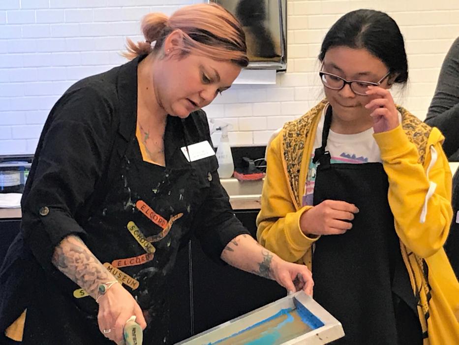 CHS AP Art History student Laina Joy Aquino learns how to create a screen print.