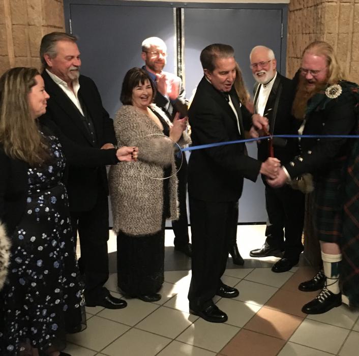 Mayor Bob Crowell cuts the ribbon for grand re-opening of Bob Boldrick Theater.