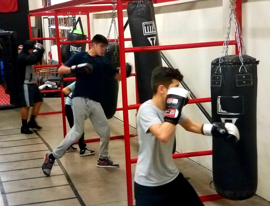 Youth hit the heavy bags Wednesday night at Tazmanian Boxing Club in Carson City.