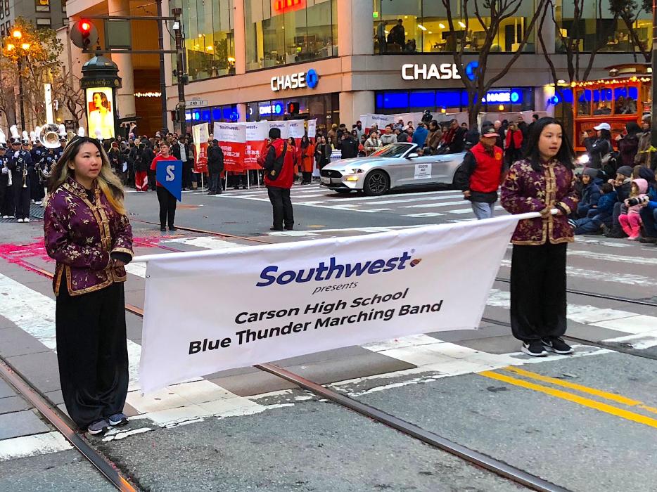 The Carson High Blue Thunder Marching Band banner in the Chinese New Year Parade Saturday.